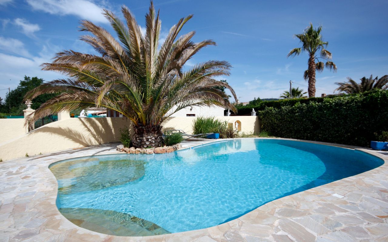 Freshly resurfaced pool with smooth pebble finish for a durable and elegant upgrade.